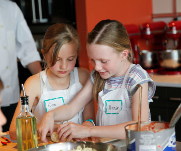 Kids participate in a cooking class at Uncorked Kitchen.